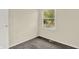 Neutral-toned bedroom with a window view and plush gray carpeting at 8920 Caminito Rd, Indianapolis, IN 46234
