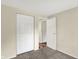 Bedroom featuring carpet and closet with doors at 8920 Caminito Rd, Indianapolis, IN 46234