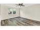 Bedroom with new luxury vinyl plank flooring and ceiling fan at 8920 Caminito Rd, Indianapolis, IN 46234