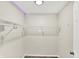A walk-in closet with white wire shelving and lights ready to be filled at 8920 Caminito Rd, Indianapolis, IN 46234
