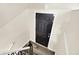 Entryway with a black front door, light beige walls, and a staircase at 8920 Caminito Rd, Indianapolis, IN 46234