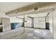 A spacious garage with cement flooring and white doors at 8920 Caminito Rd, Indianapolis, IN 46234