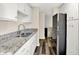 Well-lit kitchen features modern countertops, stainless steel sink, and ample cabinet space for storage and organization at 8920 Caminito Rd, Indianapolis, IN 46234