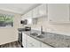 Bright kitchen with stainless steel appliances, granite countertops, and ample cabinet space, perfect for cooking at 8920 Caminito Rd, Indianapolis, IN 46234