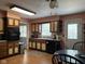 Well-equipped kitchen featuring essential appliances, laminate countertops, and ample cabinet space at 9011 Camby Rd, Camby, IN 46113