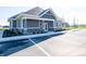 Exterior of community clubhouse featuring well-maintained landscaping and ample parking at 9137 Steinbeck Ln, Indianapolis, IN 46239