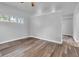 Bright bedroom featuring laminate flooring, base molding and a window at 917 W Pearl St, Lebanon, IN 46052