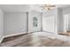 Bright bedroom with wood-look flooring, ceiling fan and closet at 917 W Pearl St, Lebanon, IN 46052