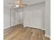 Bedroom with wood-look floors, closet, and ceiling fan at 917 W Pearl St, Lebanon, IN 46052