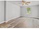 Bedroom with wood-look flooring, ceiling fan, and window at 917 W Pearl St, Lebanon, IN 46052