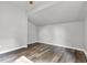 Bright bedroom showcases wood-look floors, grey walls, and a ceiling fan at 917 W Pearl St, Lebanon, IN 46052