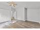 Bedroom features wood-look flooring, ceiling fan, and closet at 917 W Pearl St, Lebanon, IN 46052