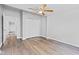 Bedroom features wood-look flooring, ceiling fan, and double closet at 917 W Pearl St, Lebanon, IN 46052