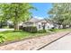 Cozy single-story home with well-maintained lawn and lush trees, enhanced by a brick walkway and tidy landscaping at 917 W Pearl St, Lebanon, IN 46052