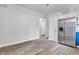 Spacious kitchen area with stainless steel refrigerator and wood-look flooring, providing a clean and modern aesthetic at 917 W Pearl St, Lebanon, IN 46052