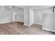Open concept living room with ceiling fan and modern laminate flooring at 917 W Pearl St, Lebanon, IN 46052
