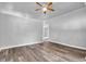 Spacious living room featuring laminate flooring, a ceiling fan, and fresh paint at 917 W Pearl St, Lebanon, IN 46052