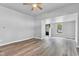 Inviting living room with a ceiling fan, laminate flooring, and a view to the outside at 917 W Pearl St, Lebanon, IN 46052