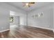 Large living room with laminate flooring, big windows and several electrical outlets at 917 W Pearl St, Lebanon, IN 46052