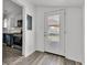 Welcoming mud room provides seamless transition to the kitchen with stainless steel appliances, perfect for modern living at 917 W Pearl St, Lebanon, IN 46052