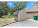 Charming storage shed with double doors and gravel base, nestled within a well-kept backyard setting at 917 W Pearl St, Lebanon, IN 46052