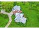 Aerial view of a charming home, showcasing its unique roofline and surrounding lush greenery, including a weeping willow at 9237 N 500 W, Fountaintown, IN 46130