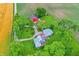 Expansive aerial view of property showing home with a red barn surrounded by lush green fields and mature trees at 9237 N 500 W, Fountaintown, IN 46130