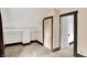 Attic featuring neutral carpet, a built in shelf, and doorway into another room at 9237 N 500 W, Fountaintown, IN 46130