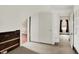 View of an attic hallway with neutral carpeting and open doorways to other rooms at 9237 N 500 W, Fountaintown, IN 46130