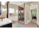 Elegant bathroom with freestanding tub, glass-enclosed shower, and stylish fixtures, offering a relaxing spa-like atmosphere at 9237 N 500 W, Fountaintown, IN 46130