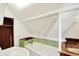 Attic bathroom showcasing a toilet, sink, and a tub with green trim at 9237 N 500 W, Fountaintown, IN 46130