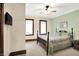Bright bedroom with neutral carpeting, ceiling fan, and two windows for ample natural light at 9237 N 500 W, Fountaintown, IN 46130