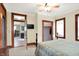 Cozy bedroom features carpet, a view of a closet, and a doorway, with natural light and a ceiling fan at 9237 N 500 W, Fountaintown, IN 46130