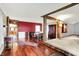 Open-concept dining room with hardwood floors and rustic wooden beam accents at 9237 N 500 W, Fountaintown, IN 46130
