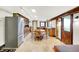 A bright kitchen with custom wood cabinets, stainless appliances, and a charming wooden table with seating at 9237 N 500 W, Fountaintown, IN 46130