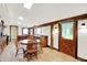 An inviting kitchen features wood cabinets, stainless appliances, and a rustic wooden table with seating for a charming space at 9237 N 500 W, Fountaintown, IN 46130