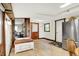 Inviting living room boasts a rustic wooden door, built-in storage bench, and open entryway to an adjoining room at 9237 N 500 W, Fountaintown, IN 46130