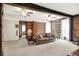 Spacious living room featuring exposed wooden beams, historic log walls, and an open layout perfect for entertaining at 9237 N 500 W, Fountaintown, IN 46130