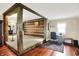 Spacious carpeted area adjacent to an office space with hardwood flooring and log walls at 9237 N 500 W, Fountaintown, IN 46130