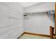 Organized walk-in closet with wire shelving for ample storage and organization of clothes and accessories at 9237 N 500 W, Fountaintown, IN 46130