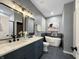 Modern bathroom featuring a double vanity with marble countertop, freestanding tub, and stylish fixtures and tiling at 9302 N Bayland Dr, McCordsville, IN 46055
