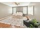 Neutral bedroom boasts hardwood floors, a ceiling fan, and bright windows with stylish shutters at 9302 N Bayland Dr, McCordsville, IN 46055