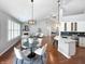 Open-concept living and dining areas with a stone fireplace and updated kitchen at 9302 N Bayland Dr, McCordsville, IN 46055