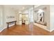 Spacious living room featuring vaulted ceilings, hardwood floors, a study area, and ample natural light at 9302 N Bayland Dr, McCordsville, IN 46055