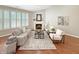 Beautiful living room with a cozy fireplace, hardwood flooring, and stylish decor, creating a warm and inviting atmosphere at 9302 N Bayland Dr, McCordsville, IN 46055