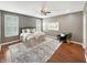 Tranquil main bedroom boasts hardwood floors, plantation shutters, and soft decor for a relaxing and comfortable space at 9302 N Bayland Dr, McCordsville, IN 46055
