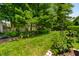 Beautiful backyard with a well-maintained lawn, decorative landscaping, and ample space for outdoor activities and enjoyment at 9520 Settlement W Dr, Indianapolis, IN 46250