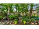 Picturesque backyard featuring a charming water feature, lush greenery, and decorative landscaping for a serene outdoor experience at 9520 Settlement W Dr, Indianapolis, IN 46250
