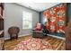 Charming room featuring cozy chair, decorative rug and quilt, creating a welcoming space at 9520 Settlement W Dr, Indianapolis, IN 46250