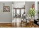 Open-concept dining area with a glass table and access to the kitchen at 9520 Settlement W Dr, Indianapolis, IN 46250